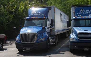 Two of our trucks posing for a photo